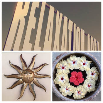 Der Namenszug „Relaxation-Area“, eine kupferfarbene Wandsonne und ein Blumen-Mandala stehen für das Ayurveda-Massageangebot